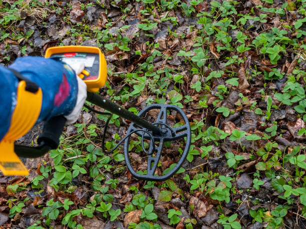 istock Metal detector while working outdoors, in the hand, searching for coins, valuables underground, archaeological 1359414794