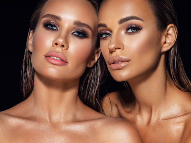 istock Two beautiful emotional women with perfect make-up 1359415663