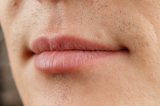 istock Human lips, human mouth close-up, red border, structure, anatomy, selective 1359416687