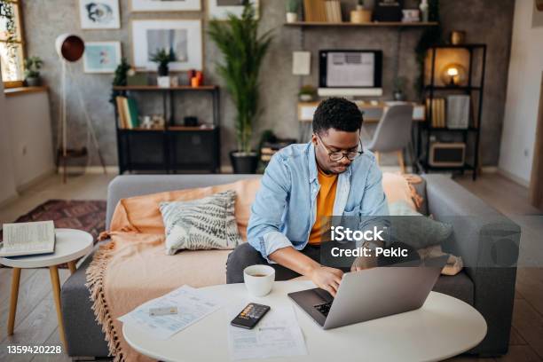 Going Over Finances At Home Stock Photo - Download Image Now - Using Laptop, Laptop, Domestic Life