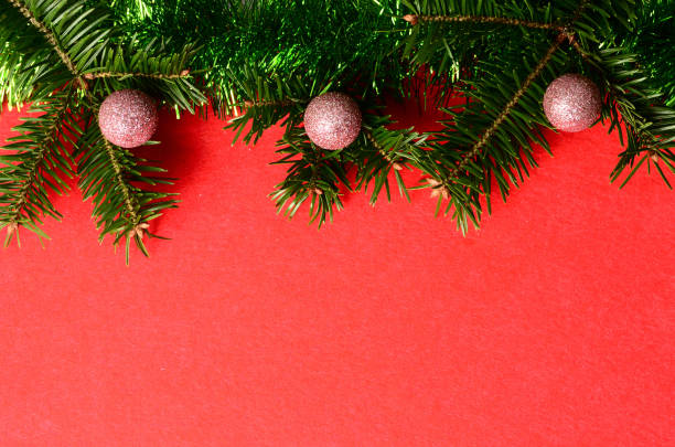 Red christmas ball on red christmas background 