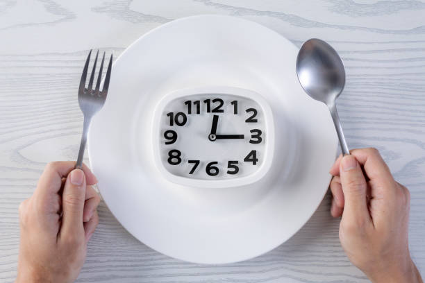 istock Eat meal time healthy eating concept hand hold spoon and fork 1359425009