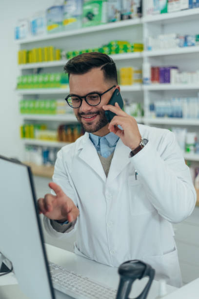 istock Portrait of a handsome pharmacist working in a pharmacy 1359426662