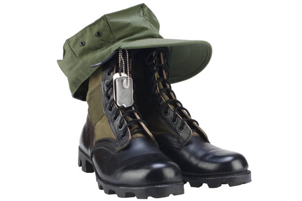 U.S. MARINES boots and cap with dog tags isolated on white background