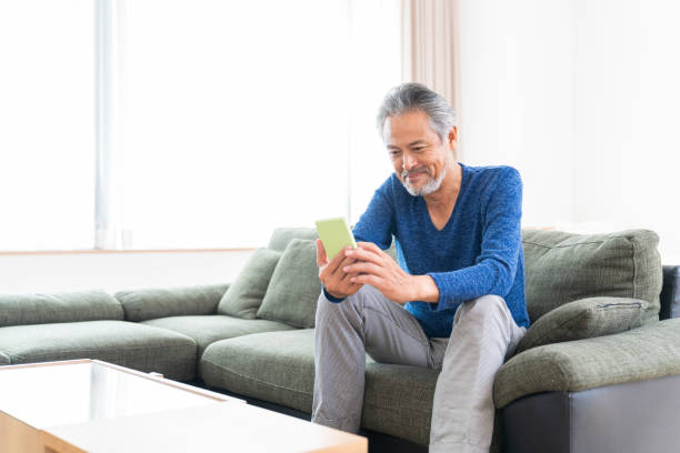 istock elderly man who uses smart phone, 1359435263