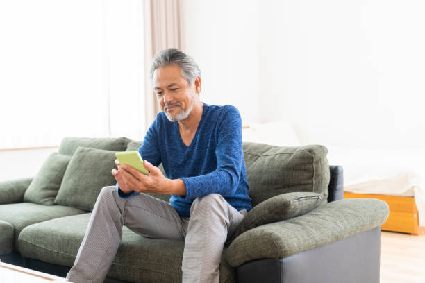 istock elderly man who uses smart phone, 1359435321