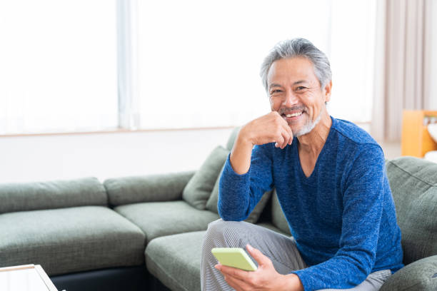 istock elderly man who uses smart phone, 1359435328