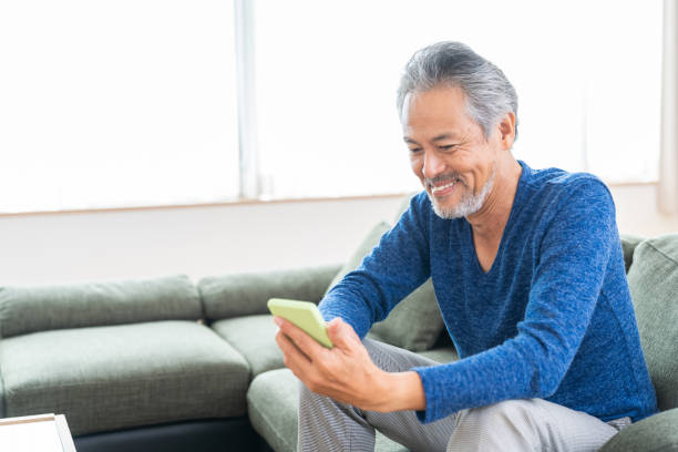 istock elderly man who uses smart phone, 1359435349