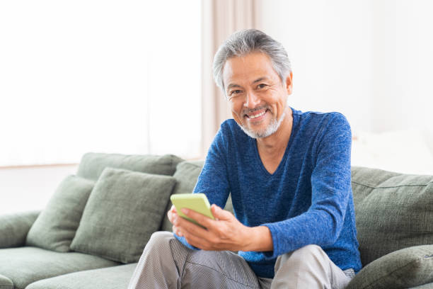 istock elderly man who uses smart phone, 1359435424