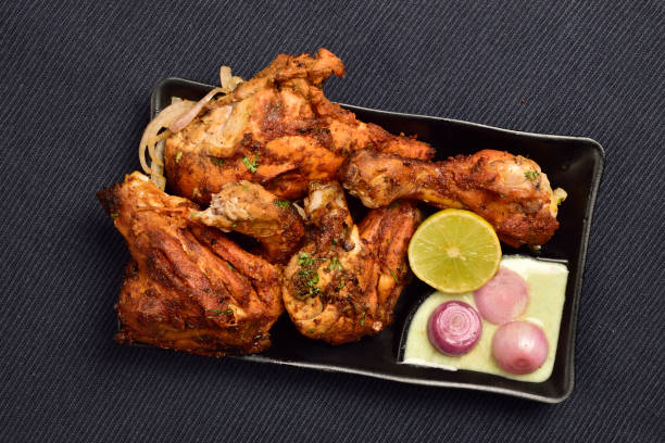 istock Tandoori Chicken with Lemon, Chutney and Onion 1359435535