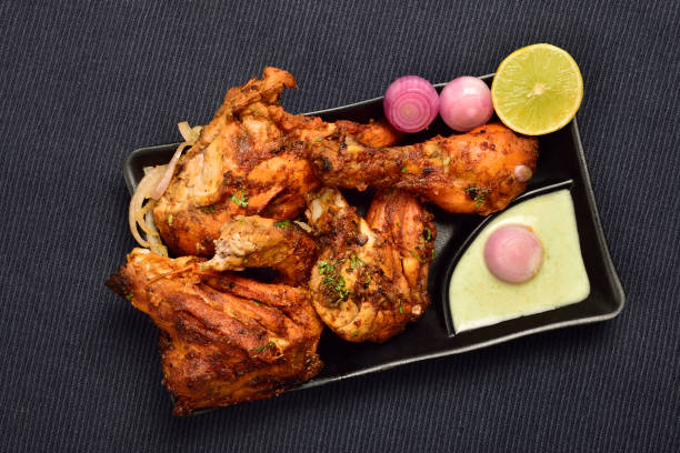 Top View of Tandoori Chicken with Chutney and onion in Plate, Famous Indian food Tandoori Murg stock photo