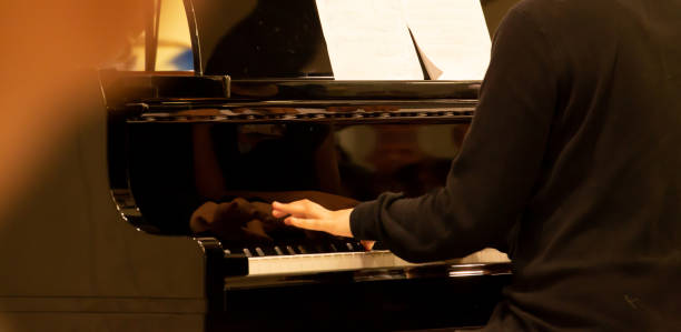istock hand playing black electric piano in musical performance 1359438092