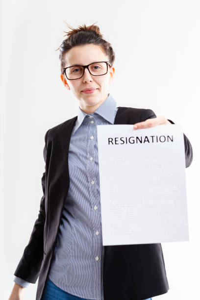 istock smiling woman quietly delivering resignation 1359440455