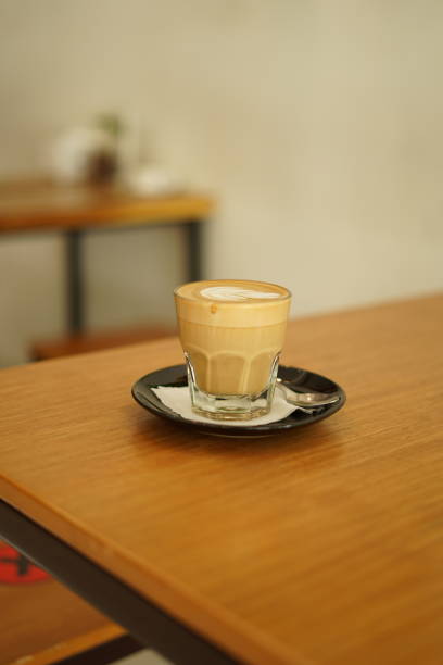 istock Latte coffee in a glass placed on the table 1359446544