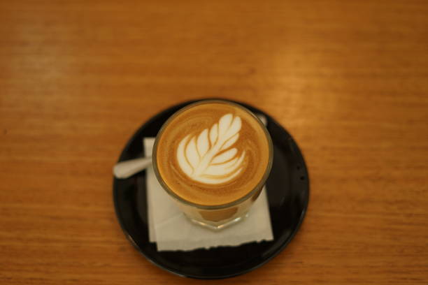 istock Latte coffee in a glass placed on the table 1359446551