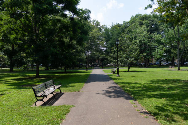 istock Empty Path at Wooster Square Park in New Haven Connecticut during the Summer with Green Grass and Trees 1359452237
