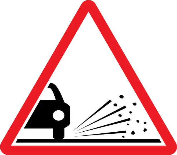 Vector illustration of Loose chippings road sign.