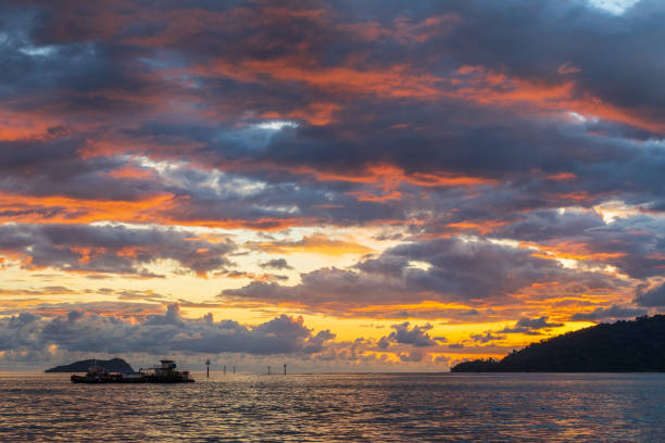 istock Beautiful Sunset with dramatic cloud at Waterfront Kota Kinabalu, Sabah, Borneo during Beautiful sunset. 1359454780