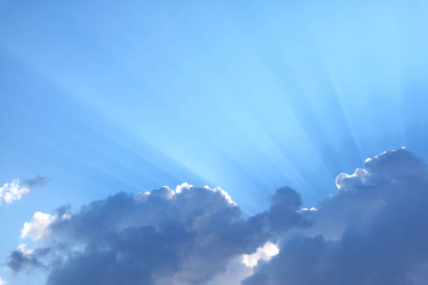 istock Spectacular Sun Rays Shining Through the Fluffy Clouds 1359466003