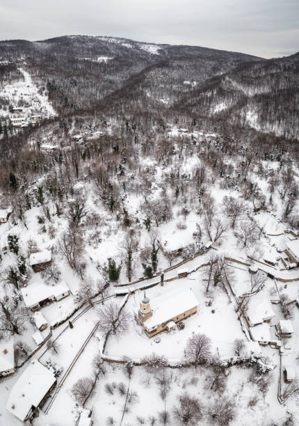 istock Snow falling over the old beautiful houses 1359469442