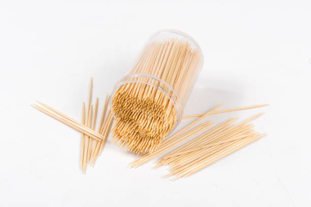 istock Wooden toothpicks and holder on white background 1359473023