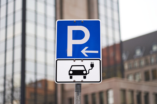 Parking sign for electric cars. Parked electric cars can be charged.