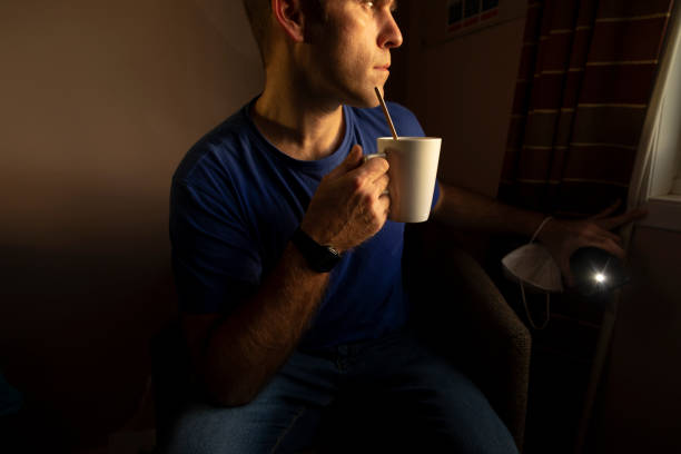 istock Man drinking tea, self isolate, whaiting results of a pcr test, UK 1359479905