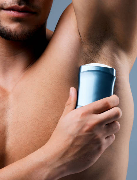 istock Studio shot of an unrecognizable man applying deodorant against a grey background 1359481306