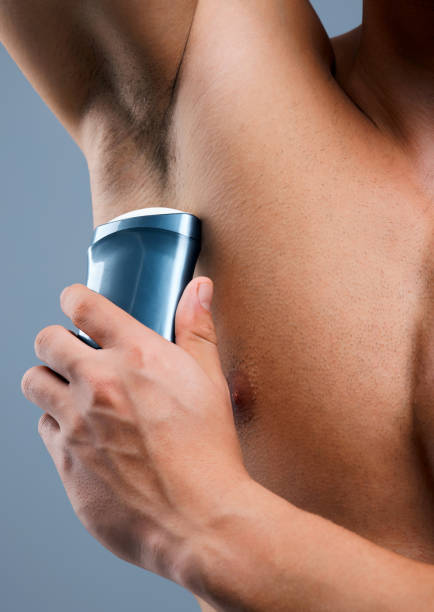 istock Studio shot of an unrecognizable man applying deodorant against a grey background 1359481314
