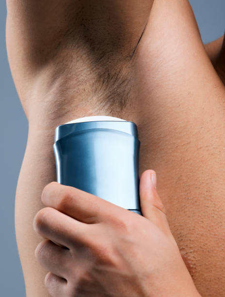 istock Studio shot of an unrecognizable man applying deodorant against a grey background 1359481315