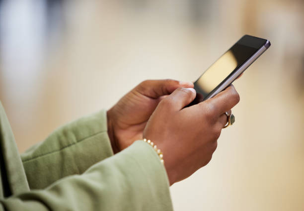 istock Shot of a woman using her smartphone to send a text 1359481615