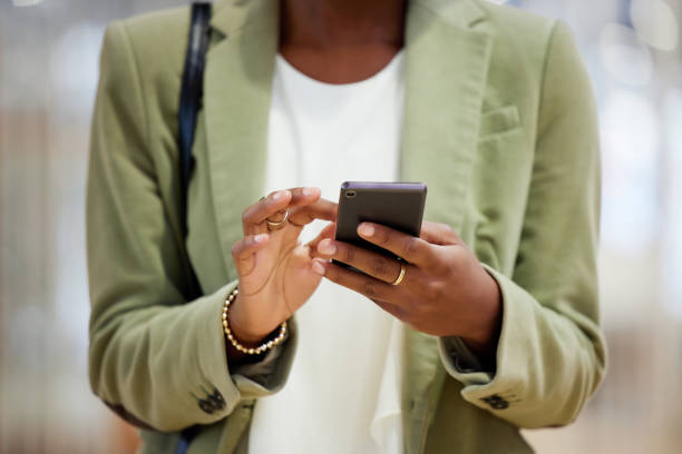 istock Shot of a woman using her smartphone to send a text 1359481618