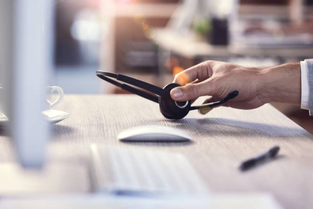 istock Shot of an unrecognizable call center agent at work 1359481795