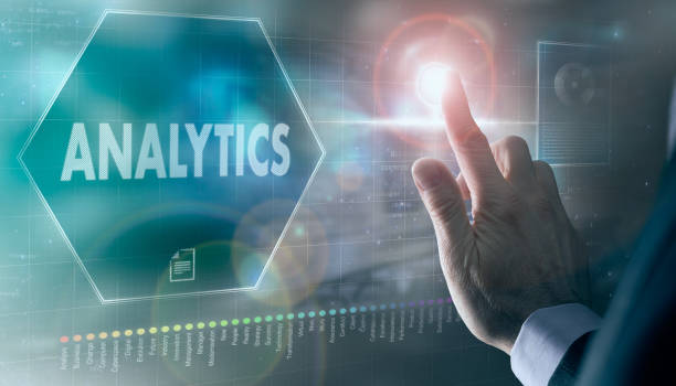 istock A businessman controlling a futuristic display with a Analytics concept on it. 1359483040