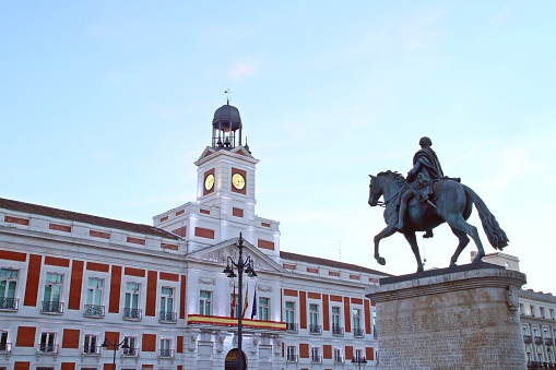 Exterior view of the ring in Madrid, Spain. Plaza de Toros de Las Ventas is the largest bullfighting ring in Spain. People sitting under  the statue of Jose Cubero (EI Yiyo).