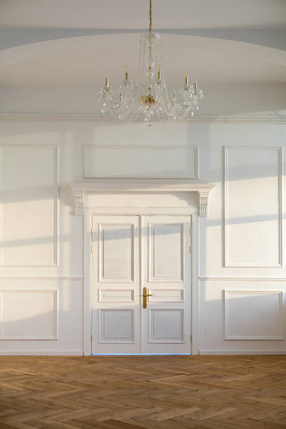 istock Spacious white classic room with closed doors 1359484237