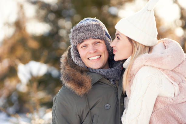 istock Couple having fun in winter scenery and snow 1359485991