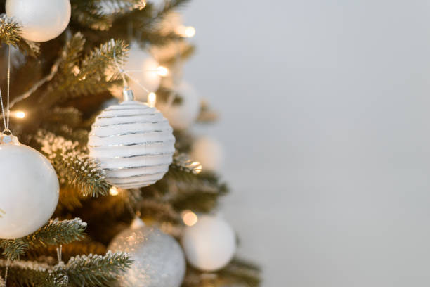 istock White Christmas decoration ball on tree 1359486430