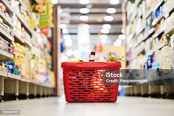 Shot Of A Shopping Basket On The Floor Of A Grocery Store Stock Photo - Download Image Now
