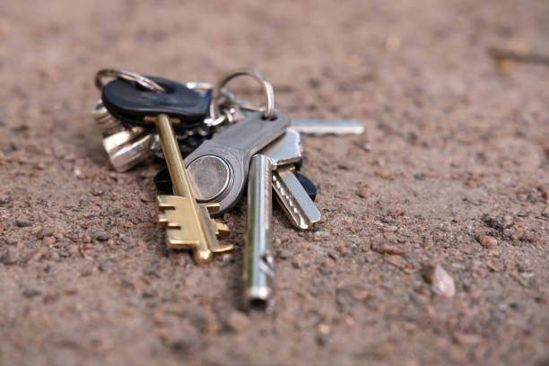 istock Keys and keychain, lost, lie on the road. Bottom view. 1359488620
