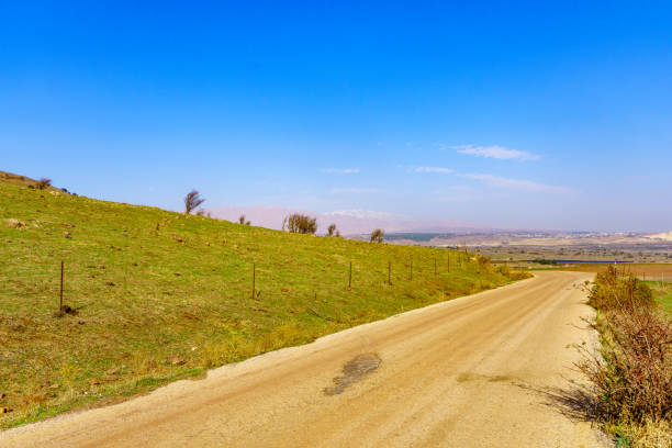 istock Dirt road, landscape, and Mount Hermon. The Golan Heights 1359490030