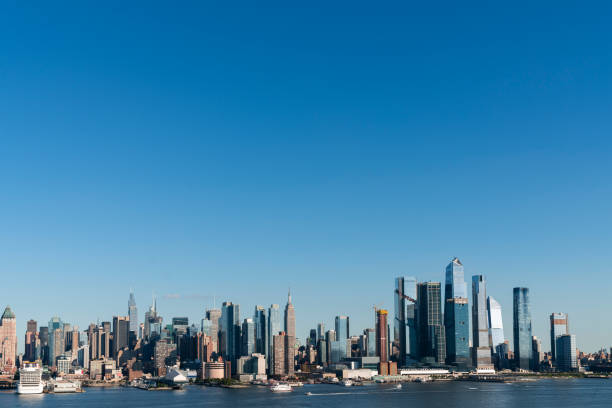 New York City skyline from New Jersey over the Hudson River with the skyscrapers of the Hudson Yards district at day time. Manhattan, Midtown, NYC, USA. A vibrant business neighborhood New York City skyline from New Jersey over the Hudson River with the skyscrapers of the Hudson Yards district at day time. Manhattan, Midtown, NYC, USA. A vibrant business neighborhood major us cities stock pictures, royalty-free photos & images