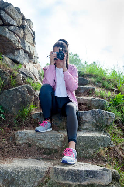 istock Young woman learning to be a photographer 1359490177