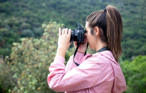istock Young woman learning to be a photographer 1359490178