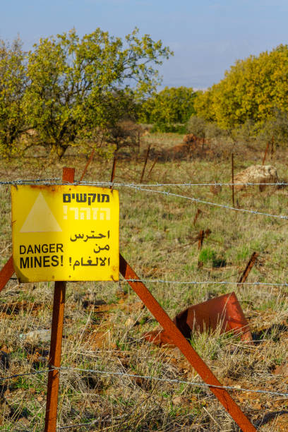 istock Trilingual warning sign - danger mines - in the Golan Heights 1359490931