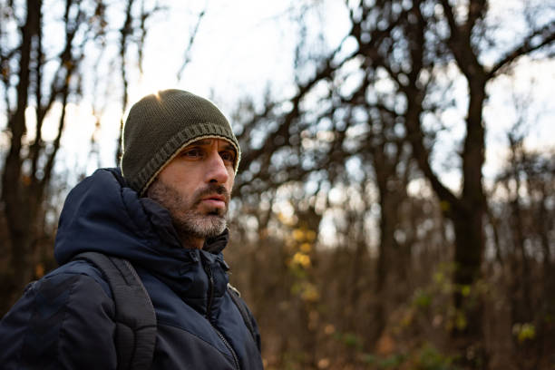 istock Young man hiking on a cold winter day 1359490936