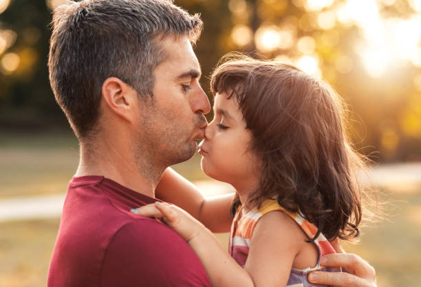 istock Happy father playing with his daughter in park. 1359491091