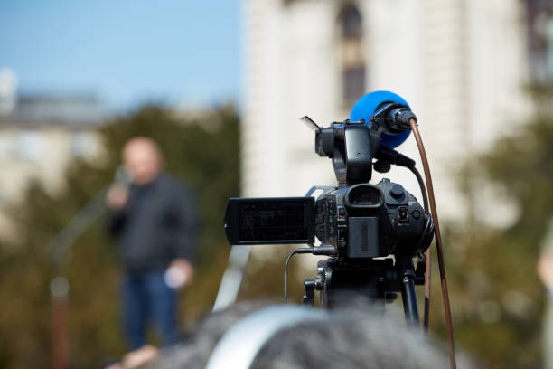 istock News broadcasting and recording protest on the streets. 1359492907