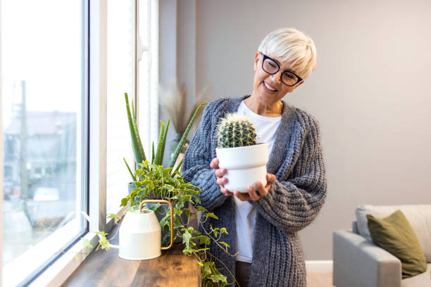 istock Active senior woman enjoying planting. 1359492990