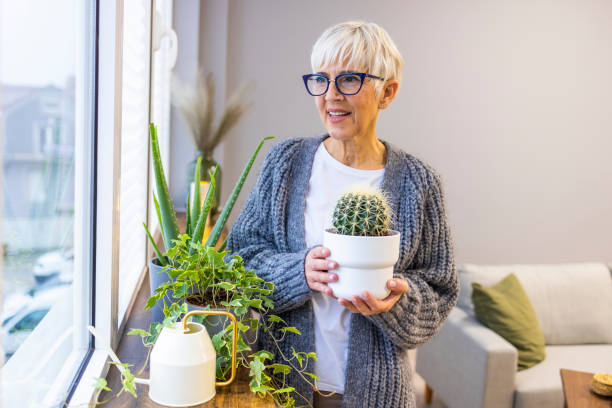 istock Active senior woman enjoying planting. 1359492997